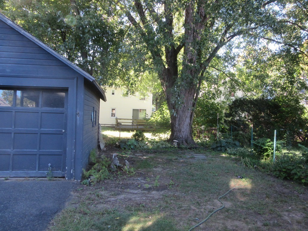 50-52 Dwight Road Springfield, MA 01108 - Photo 8 of 24 a backyard of a house with lots of green space