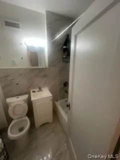 a view of a livingroom with stairs