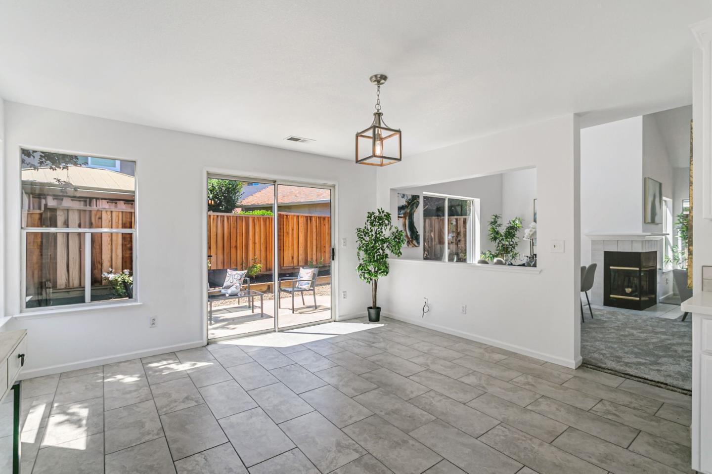 770 Babbs Creek Drive Gilroy, CA 95020 - Photo 12 of 39 a view of a livingroom with wooden floor fireplace and windows