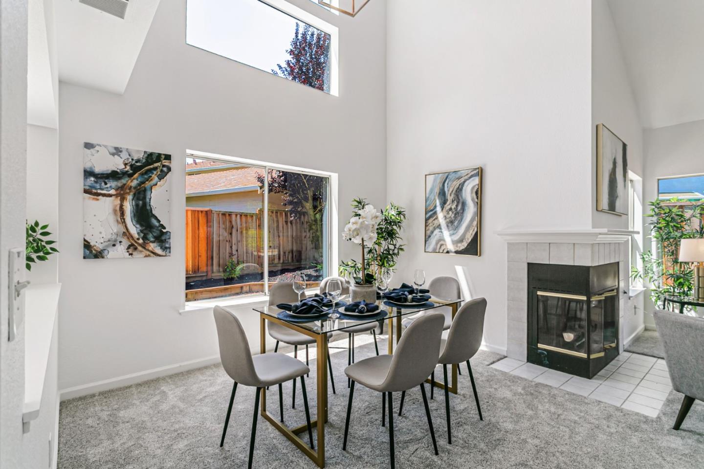 770 Babbs Creek Drive Gilroy, CA 95020 - Photo 14 of 39 a dining room with furniture a fireplace and wooden floor
