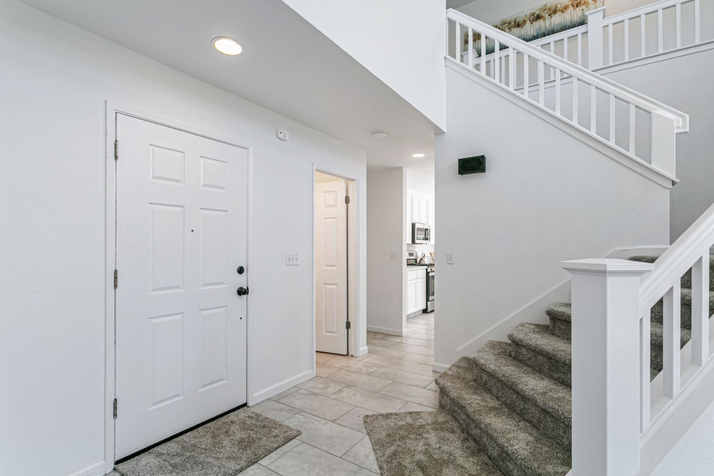 770 Babbs Creek Drive Gilroy, CA 95020 - Photo 17 of 39 a view of a hallway with entryway and hall with wooden floor