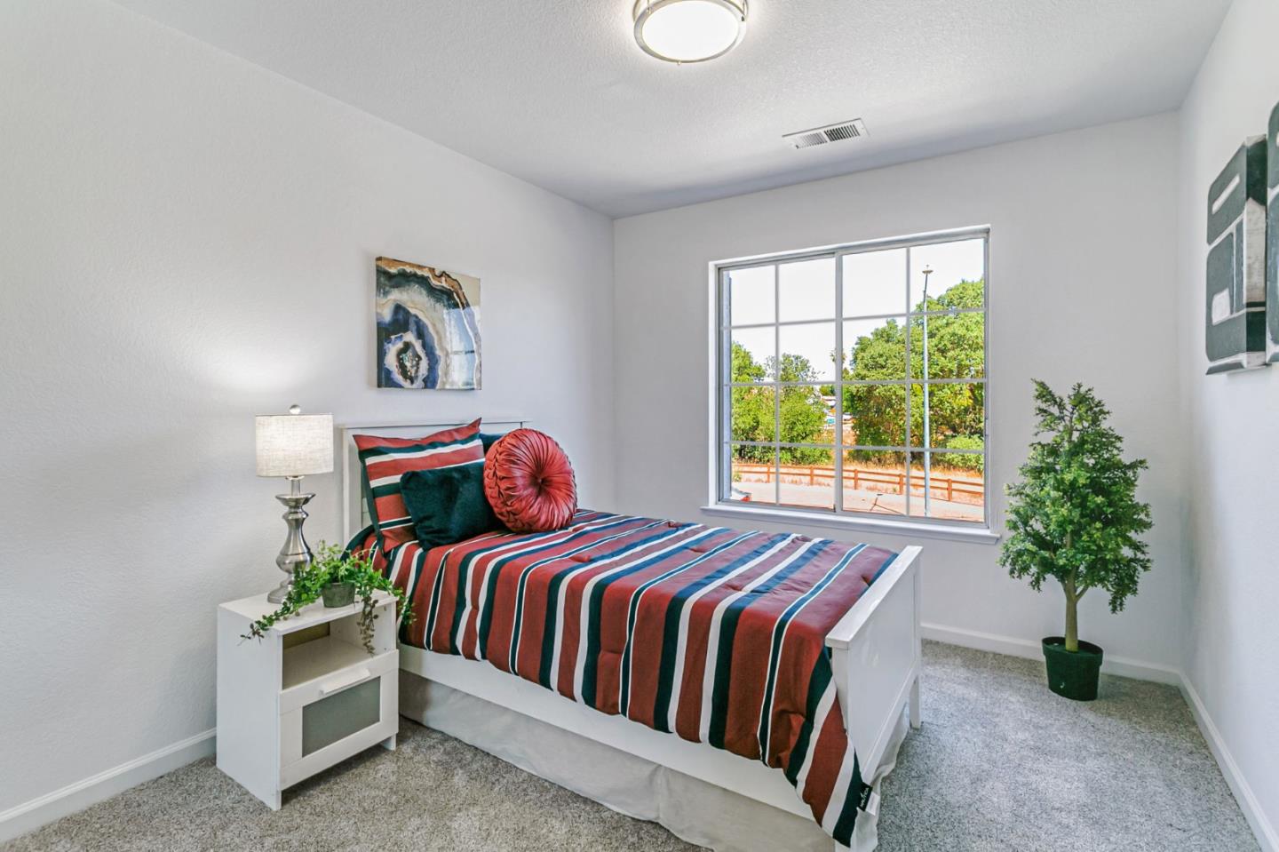 770 Babbs Creek Drive Gilroy, CA 95020 - Photo 21 of 39 a bedroom with a bed and a potted plant