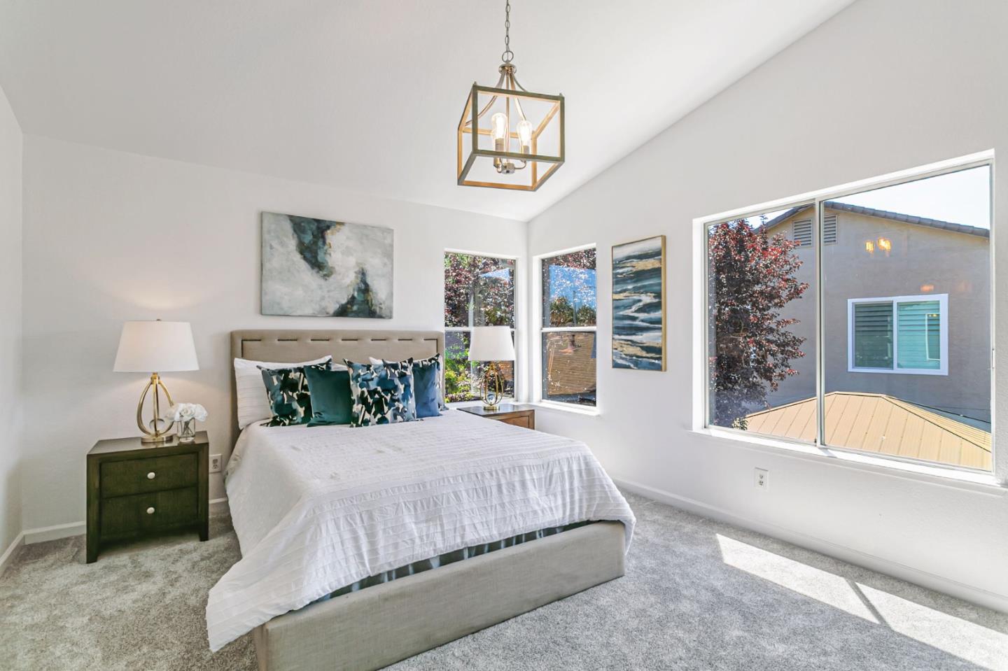 770 Babbs Creek Drive Gilroy, CA 95020 - Photo 25 of 39 a bedroom with a large bed and a chandelier