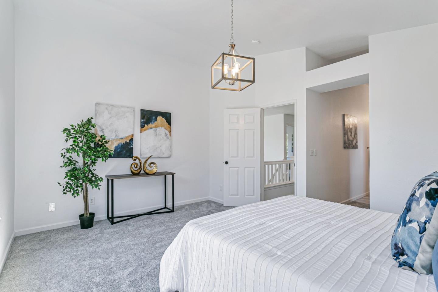 770 Babbs Creek Drive Gilroy, CA 95020 - Photo 27 of 39 a bedroom with a bed and a potted plant