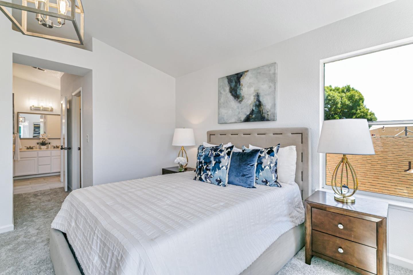 770 Babbs Creek Drive Gilroy, CA 95020 - Photo 29 of 39 a bedroom with a bed and a painting on the wall