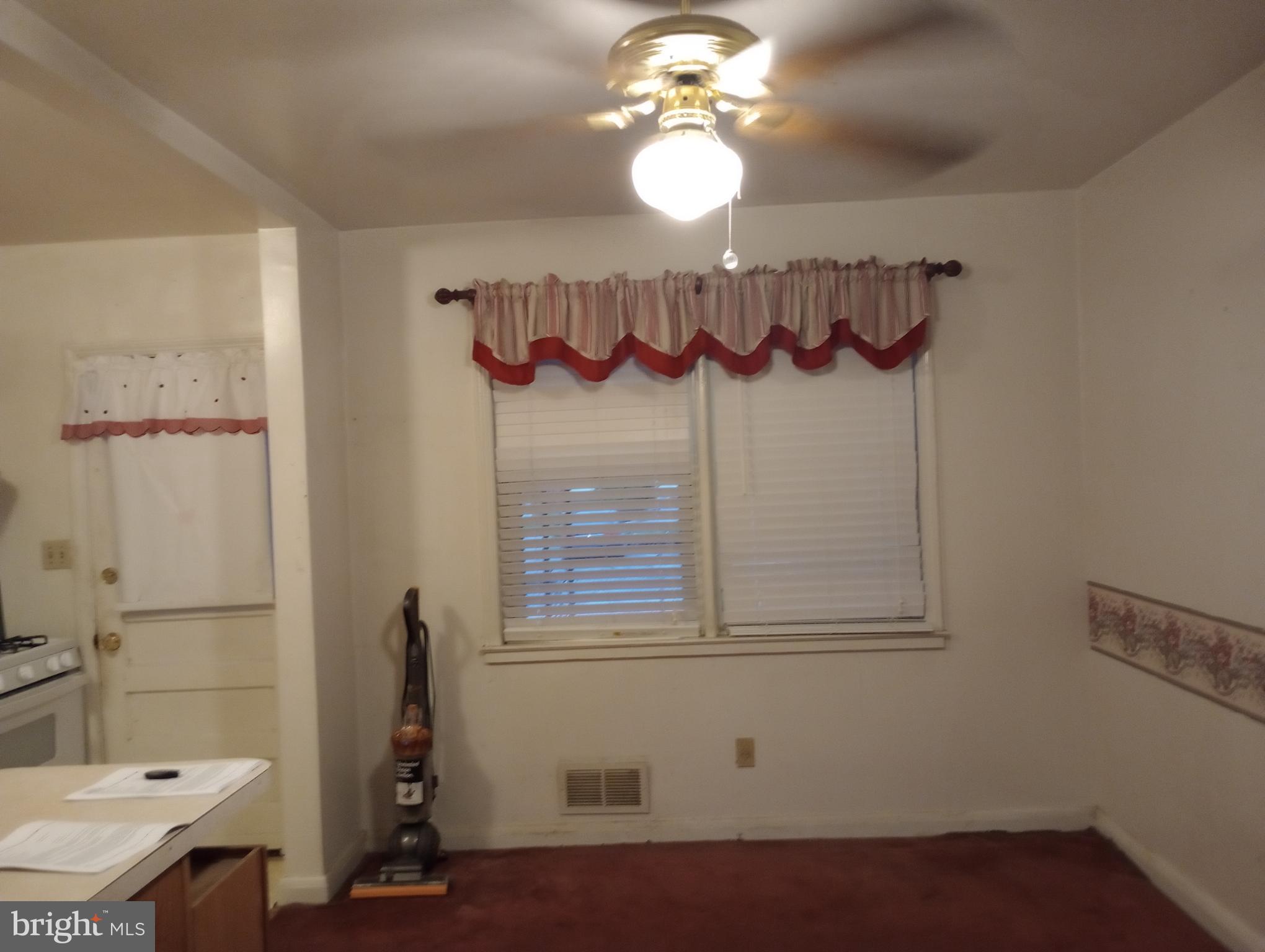7527 Westfield Road Dundalk, MD 21222 - Photo 4 of 5 a view of a bathroom with a sink and a mirror
