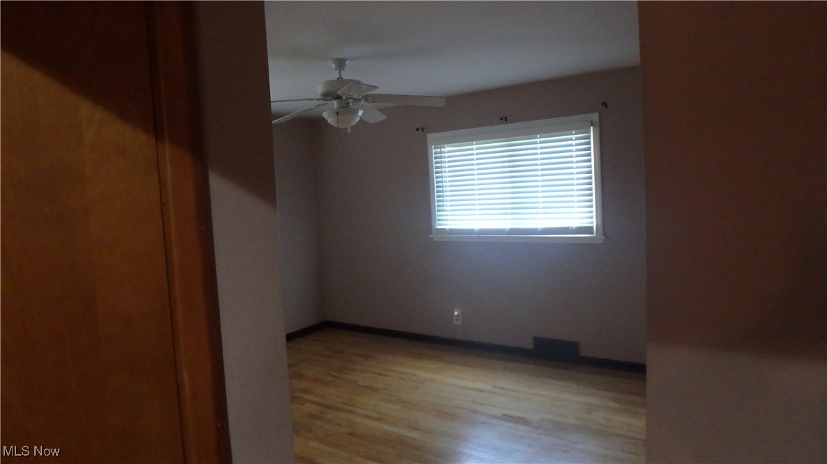 2901 Dentzler Road Parma, OH 44134 - Photo 15 of 25 Spare room featuring a ceiling fan and light wood-type flooring