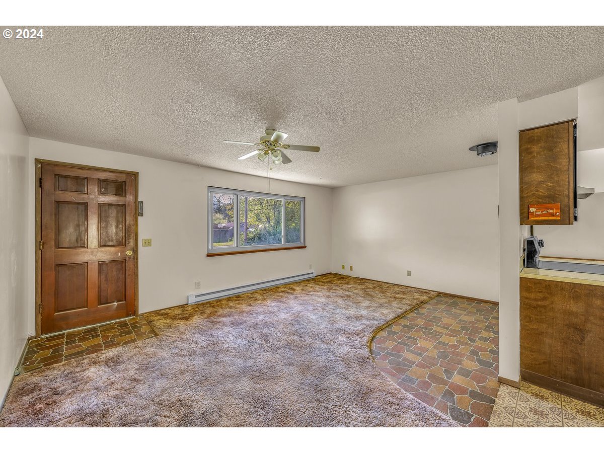 69711 Marcott Road Rainier, OR 97048 - Photo 5 of 18 a view of an empty room and window