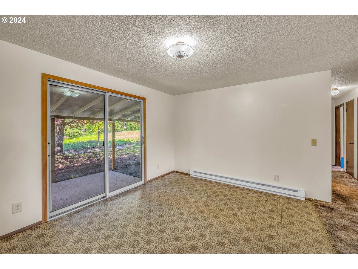 69711 Marcott Road Rainier, OR 97048 - Photo 8 of 18 a view of an empty room and window
