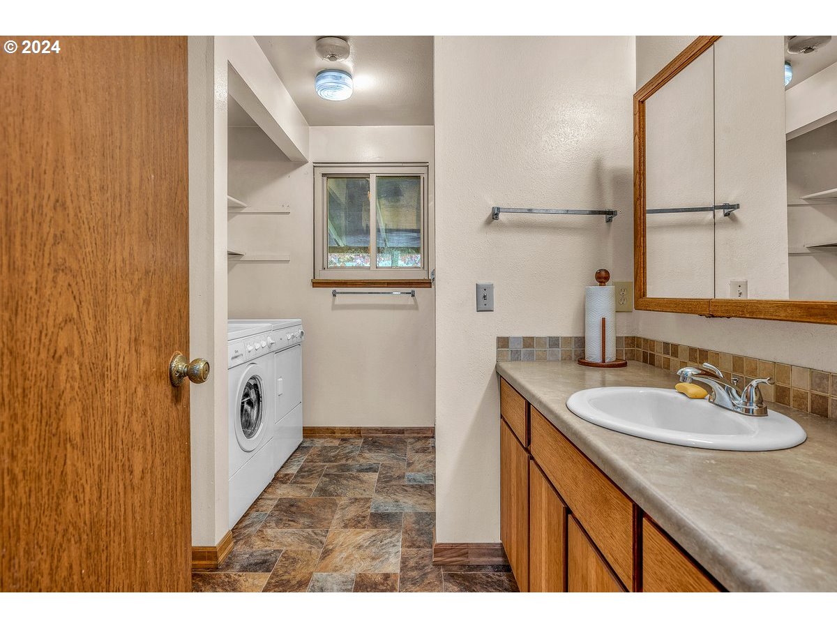 69711 Marcott Road Rainier, OR 97048 - Photo 9 of 18 a bathroom with a sink and a mirror