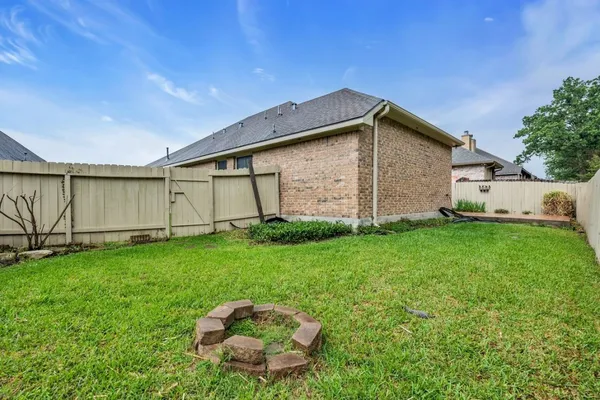 a backyard of a house with lots of green space