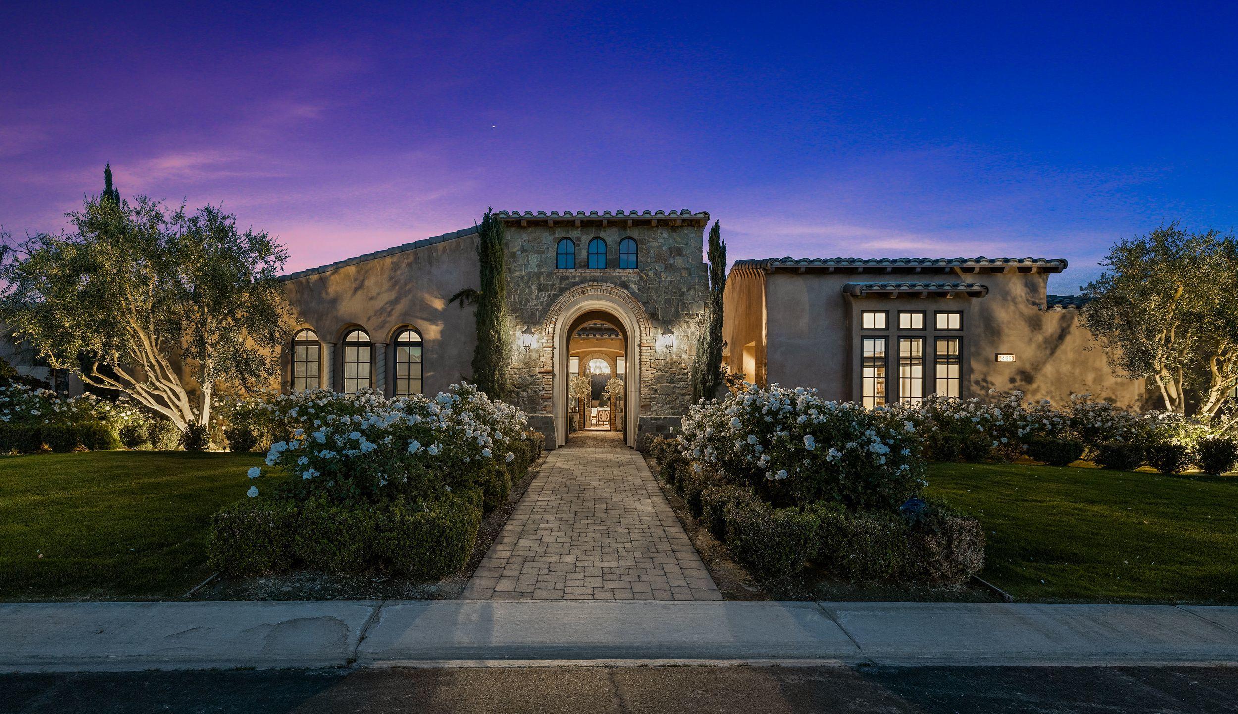 54360 Alysheba Drive La Quinta, CA 92253 - Photo 1 of 24 a front view of a house with garden