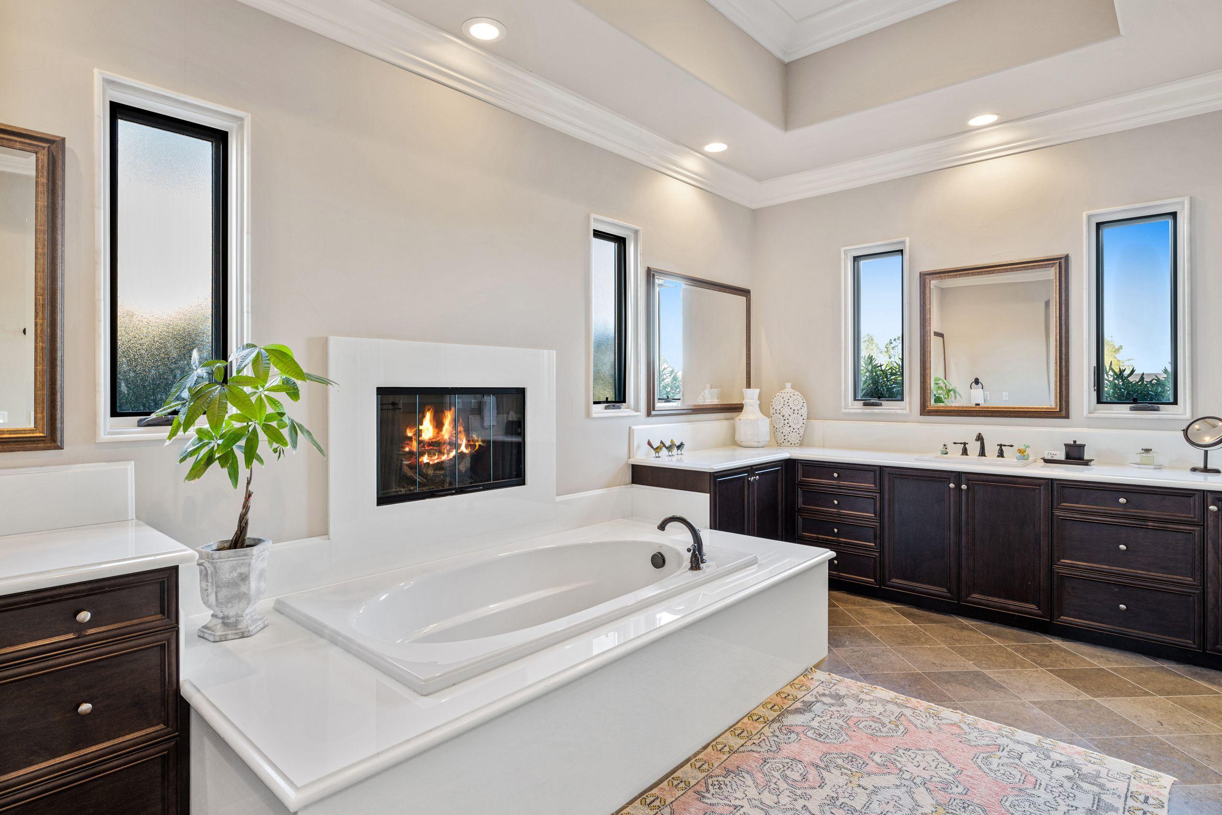 54360 Alysheba Drive La Quinta, CA 92253 - Photo 16 of 24 a spacious bathroom with a tub sink and mirror