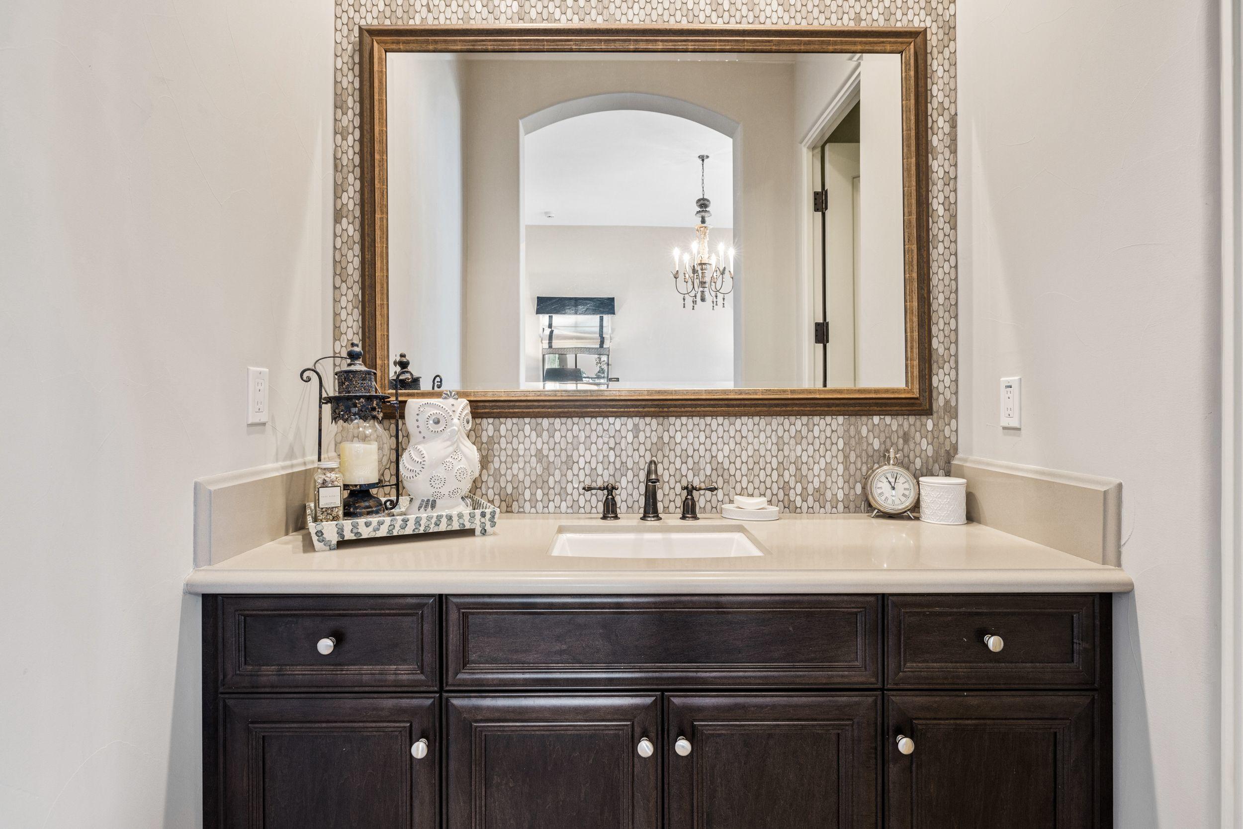 54360 Alysheba Drive La Quinta, CA 92253 - Photo 18 of 24 a bathroom with a sink vanity and a mirror
