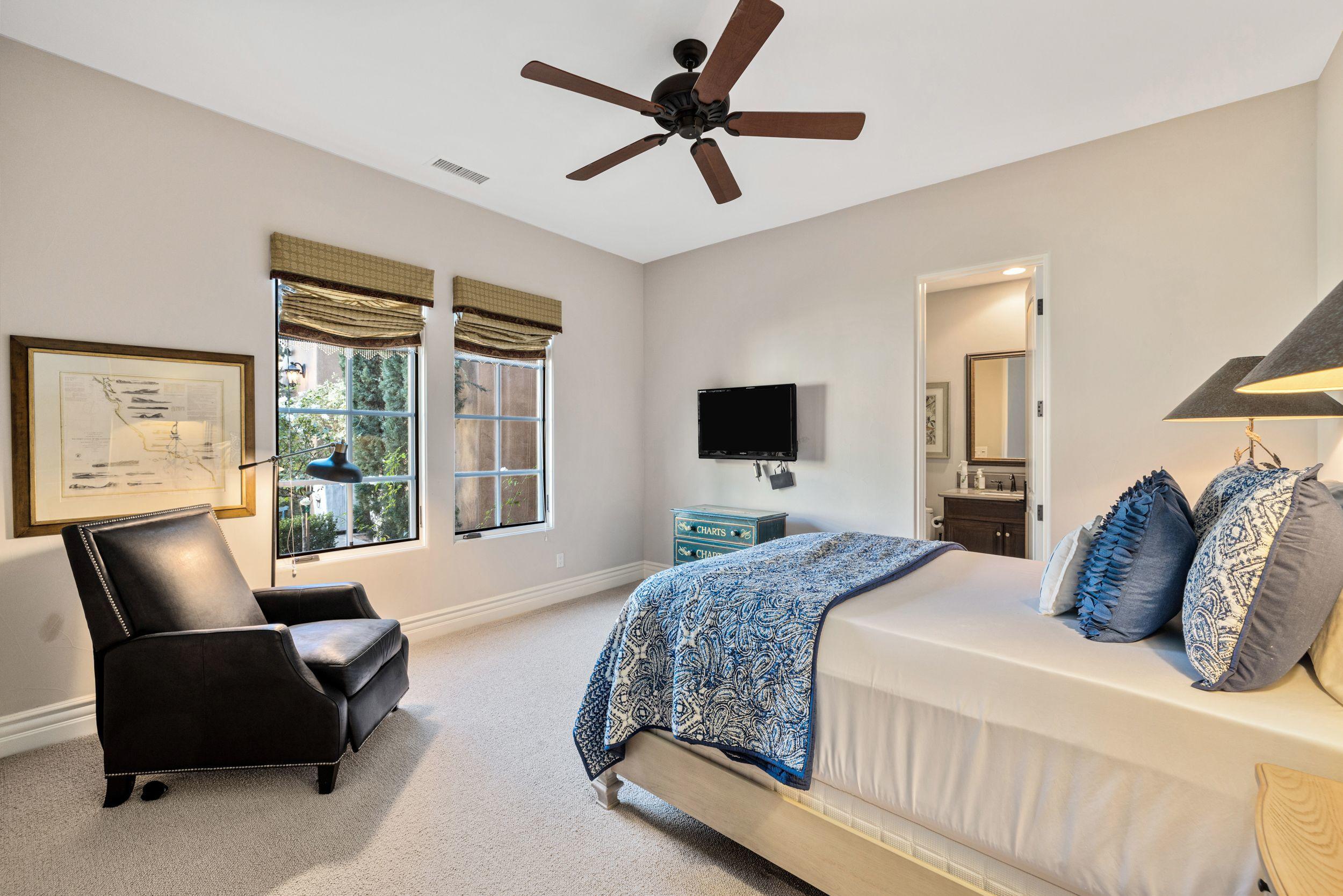 54360 Alysheba Drive La Quinta, CA 92253 - Photo 19 of 24 a bedroom with bed window and couch