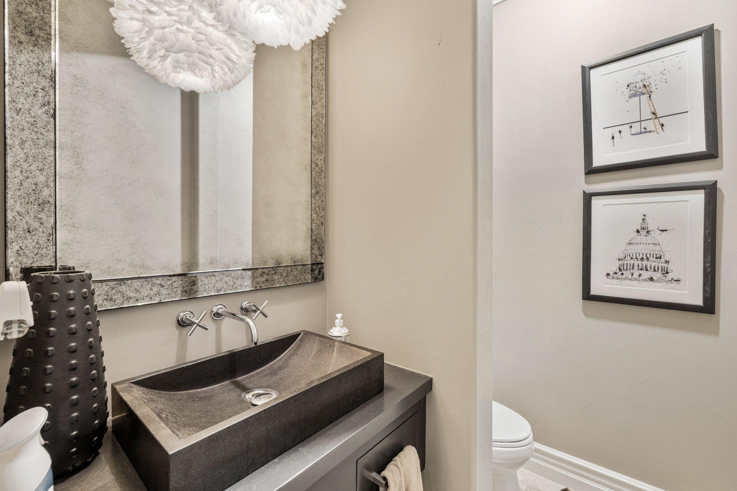 54360 Alysheba Drive La Quinta, CA 92253 - Photo 20 of 24 a bathroom with a sink a toilet and a mirror