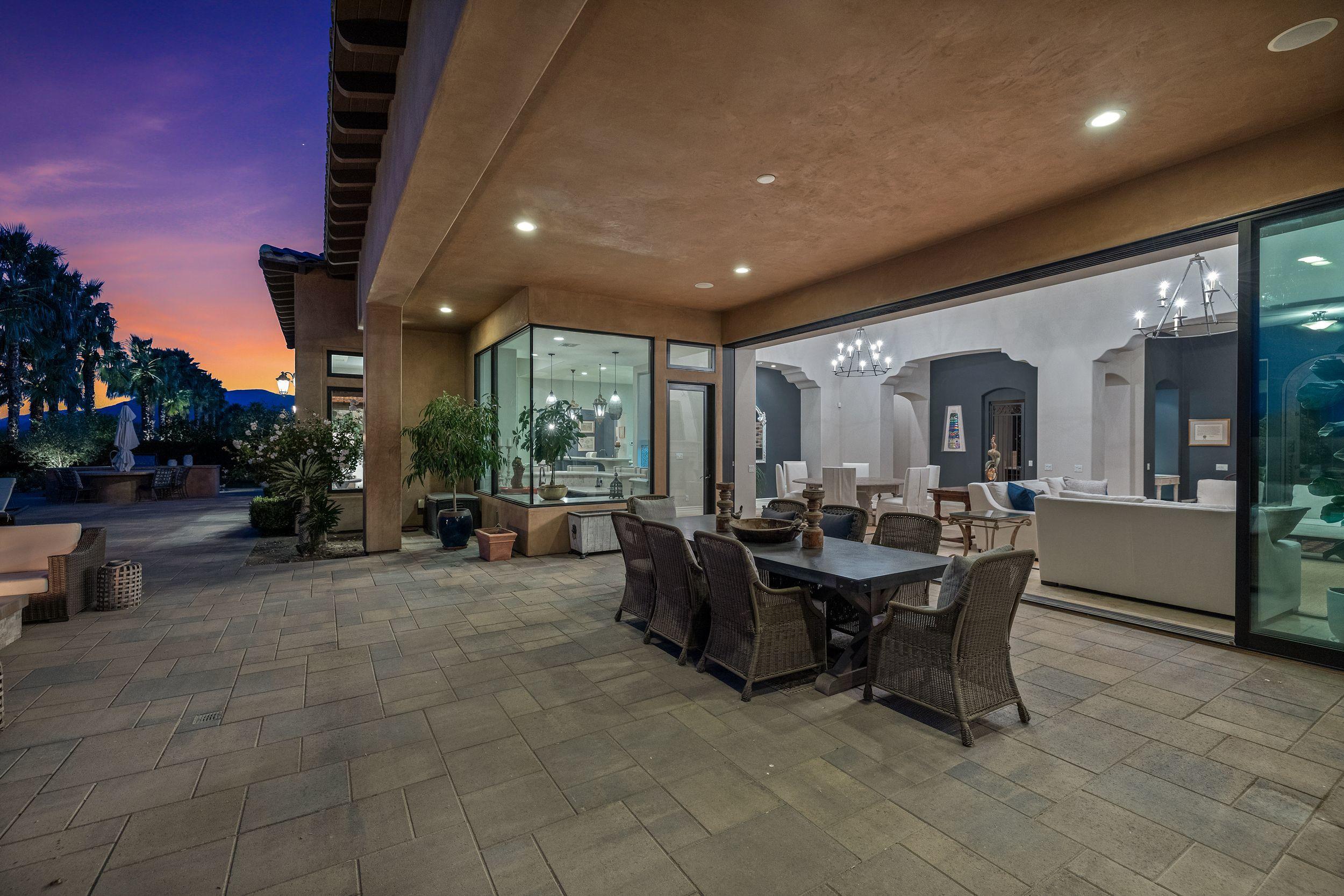 54360 Alysheba Drive La Quinta, CA 92253 - Photo 21 of 24 a view of a dining room with furniture and chandelier