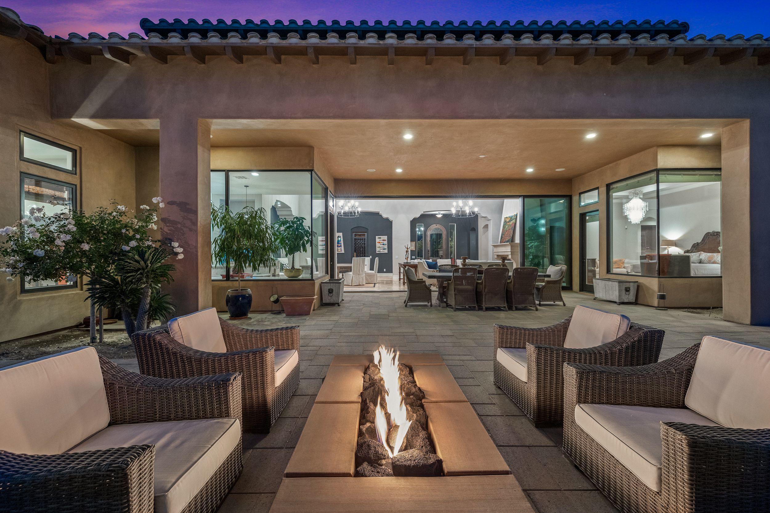 54360 Alysheba Drive La Quinta, CA 92253 - Photo 22 of 24 a living room with furniture and a fireplace