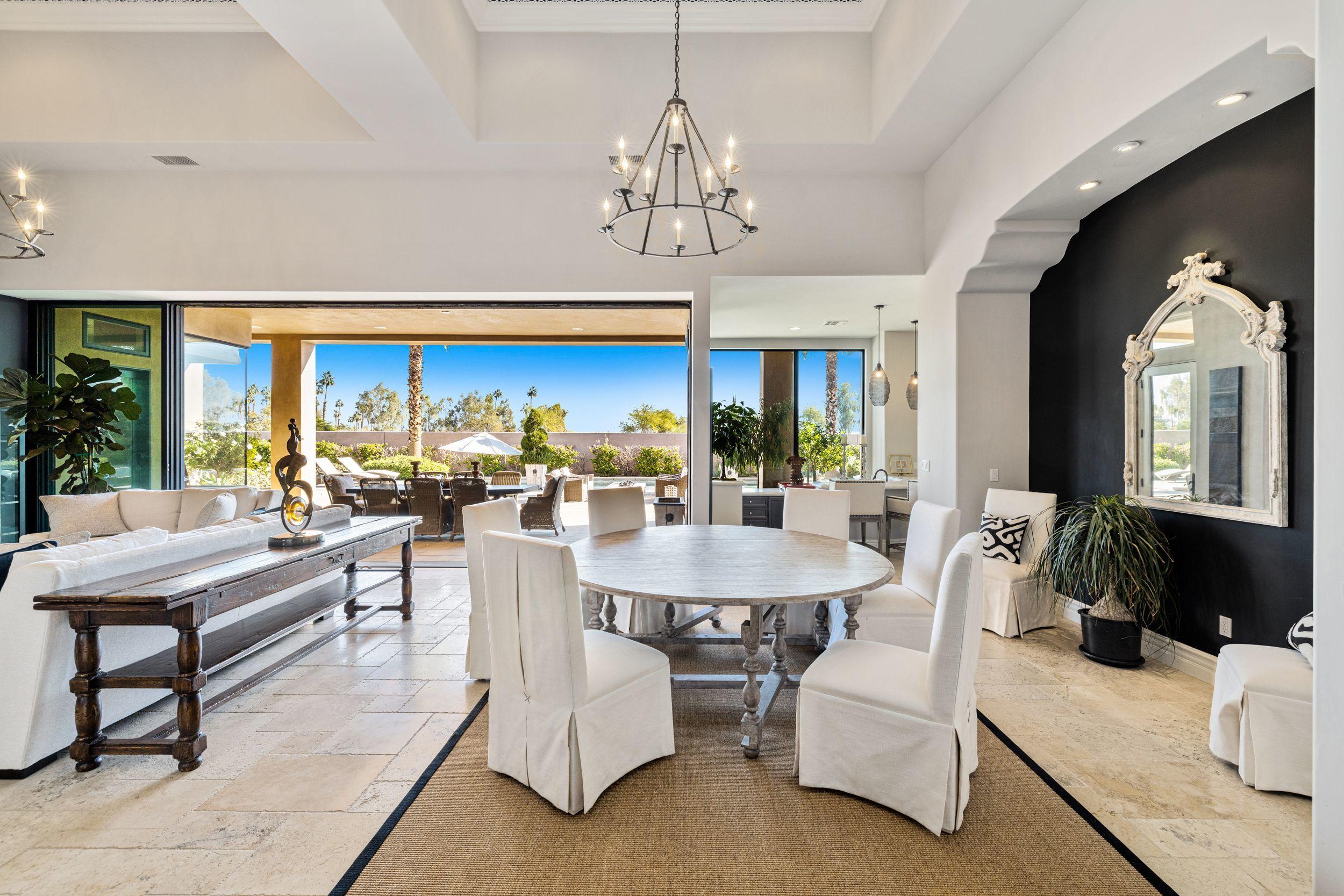 54360 Alysheba Drive La Quinta, CA 92253 - Photo 4 of 24 a view of a dining room with furniture window and outside view