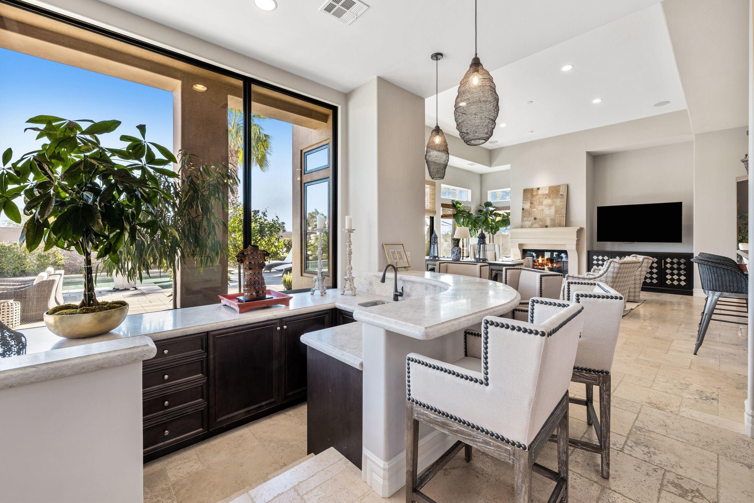 54360 Alysheba Drive La Quinta, CA 92253 - Photo 5 of 24 a kitchen with granite countertop a sink and a stove