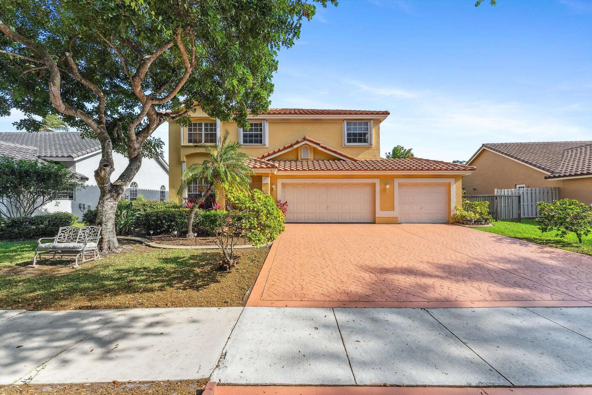 640 Culpepper Terrace Davie, FL 33325 - Photo 2 of 68 a front view of a house with garden