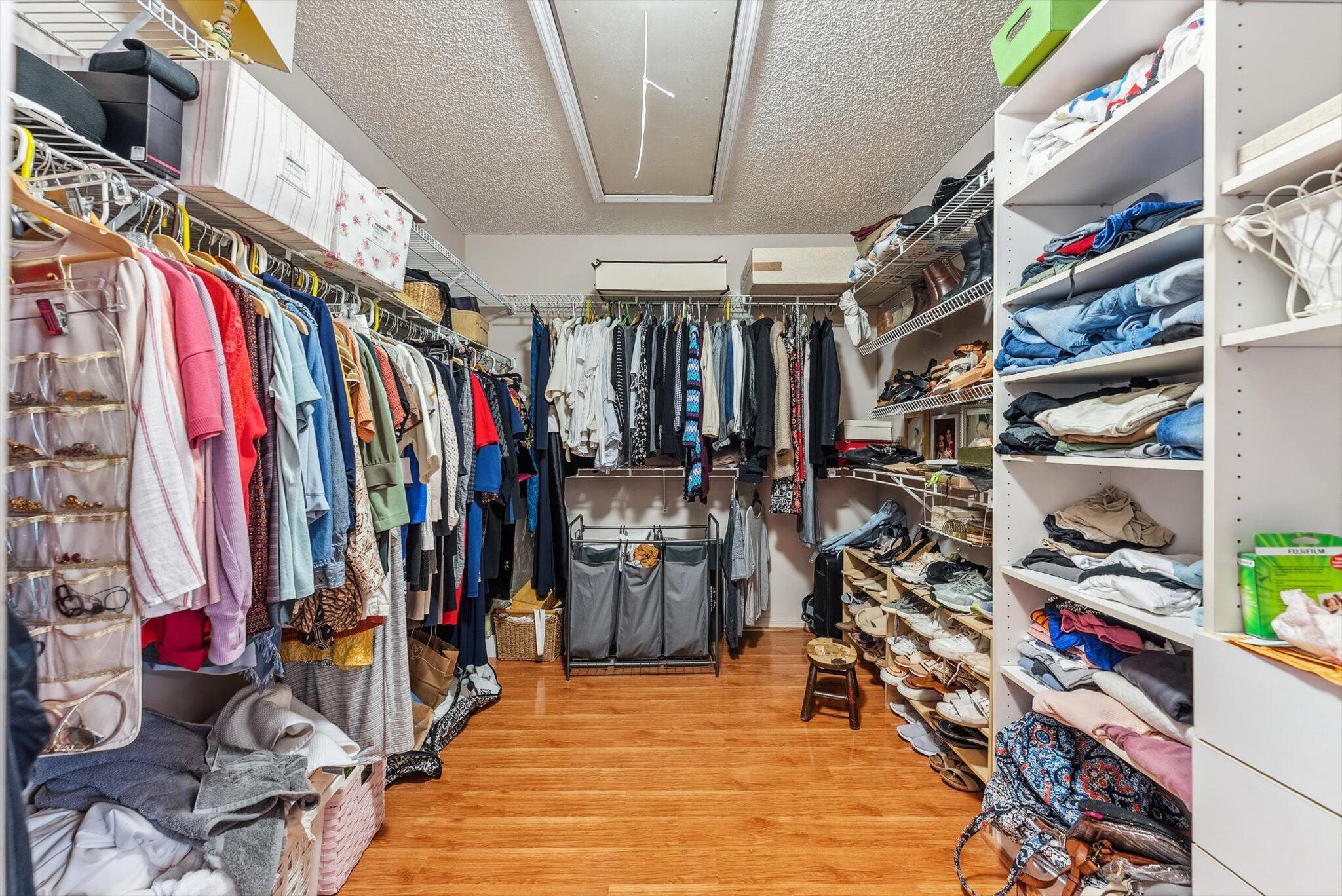 640 Culpepper Terrace Davie, FL 33325 - Photo 40 of 68 a view of walk in closet with clothes and shoes