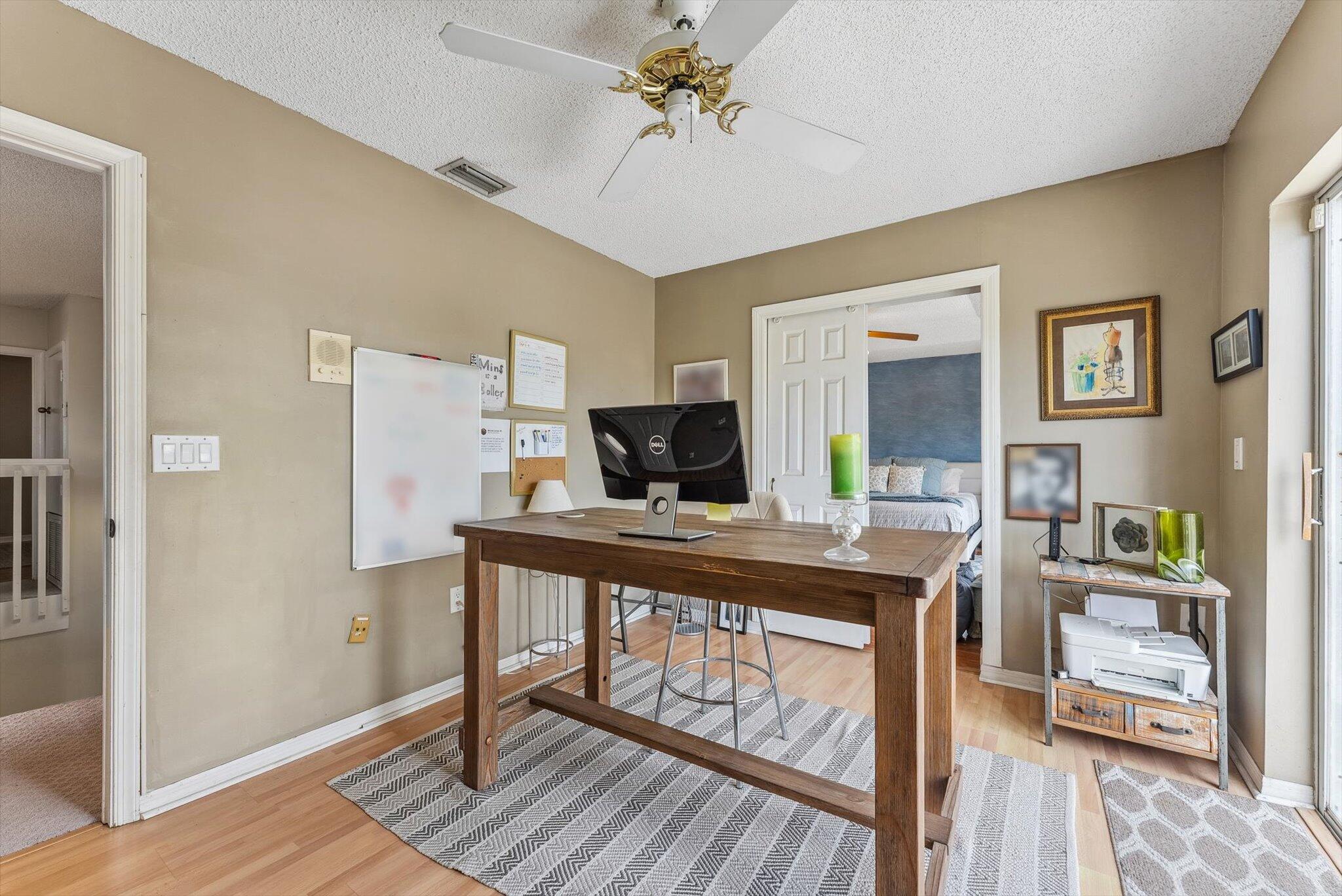 640 Culpepper Terrace Davie, FL 33325 - Photo 42 of 68 a view of a workspace with furniture and wooden floor