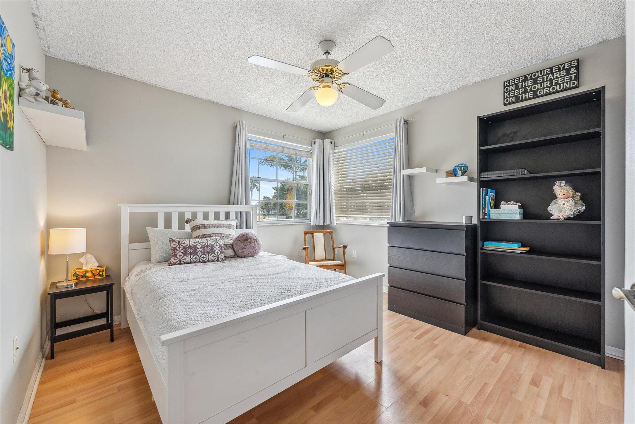 640 Culpepper Terrace Davie, FL 33325 - Photo 44 of 68 a bedroom with a bed and a chandelier