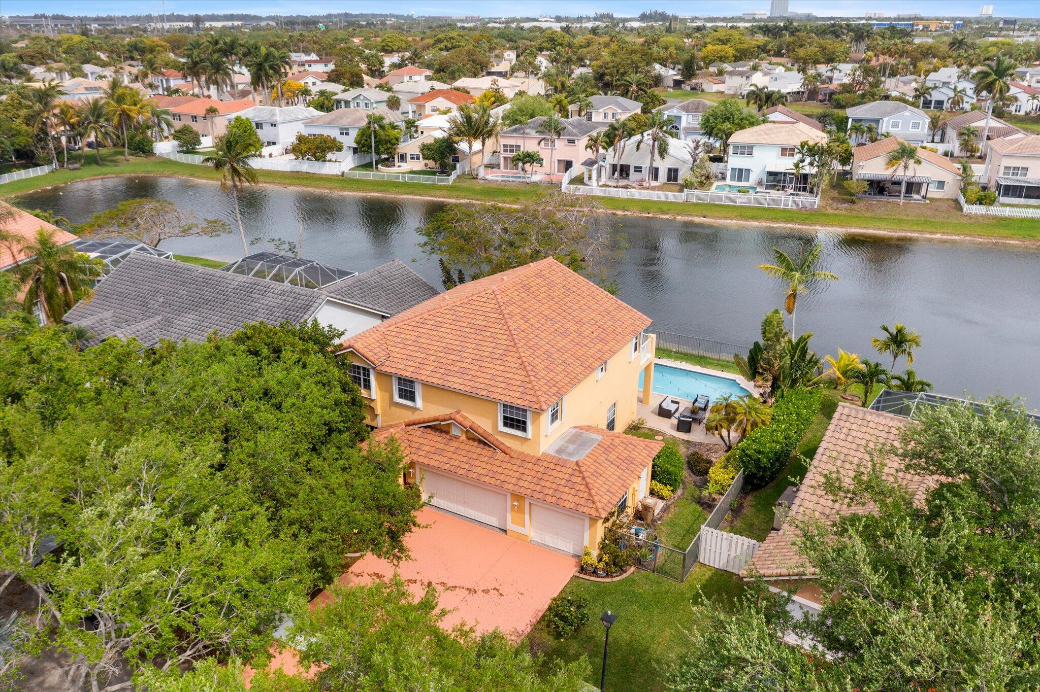 640 Culpepper Terrace Davie, FL 33325 - Photo 53 of 68 an aerial view of residential houses with outdoor space and lake view