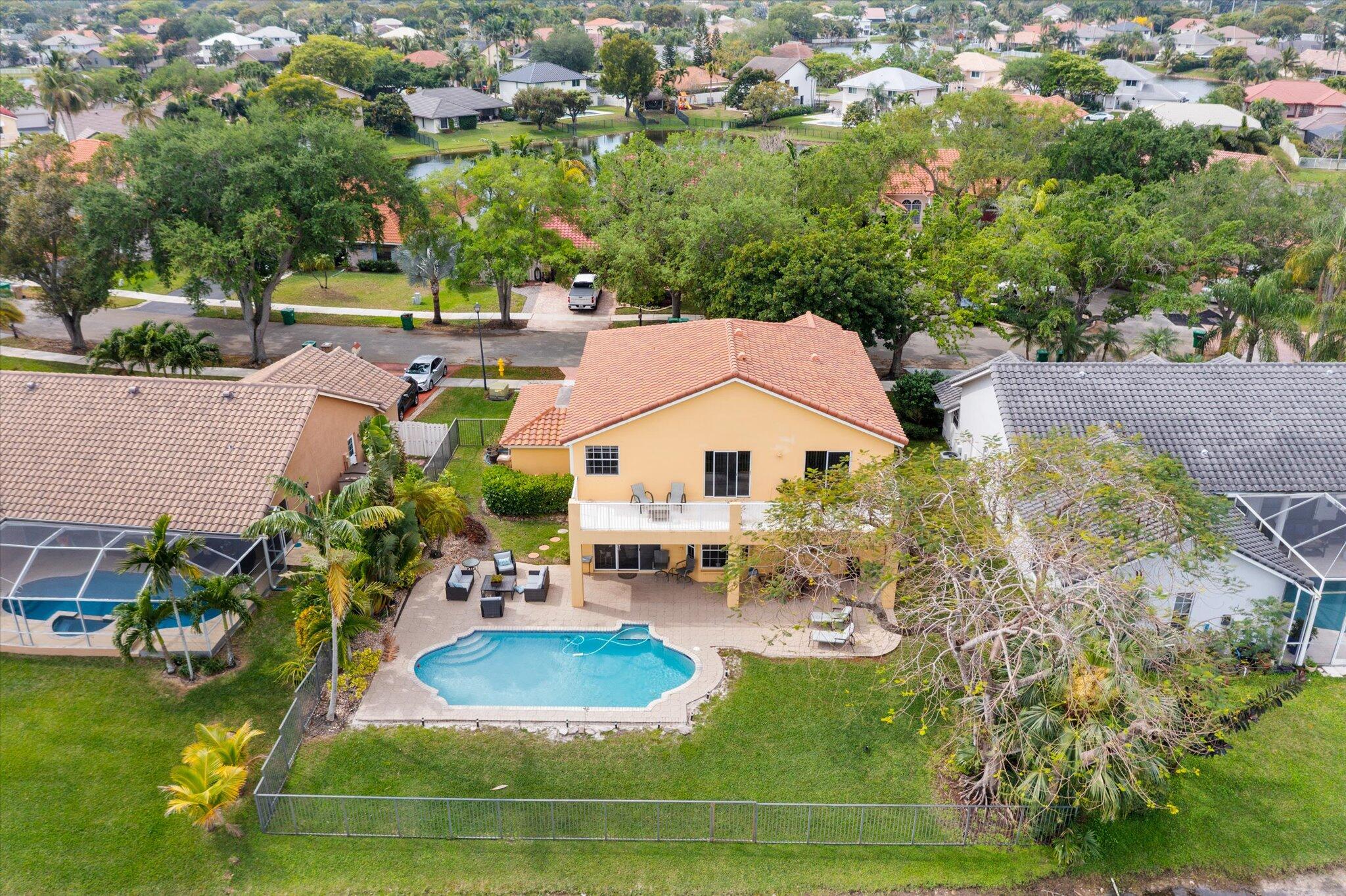640 Culpepper Terrace Davie, FL 33325 - Photo 55 of 68 an aerial view of a house with a yard swimming pool and outdoor seating