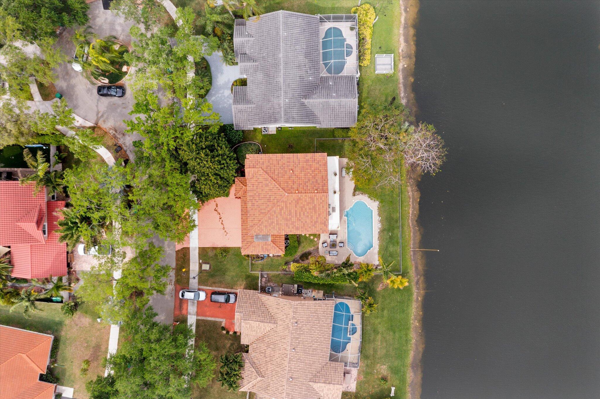 640 Culpepper Terrace Davie, FL 33325 - Photo 58 of 68 an aerial view of a house with a yard and garden