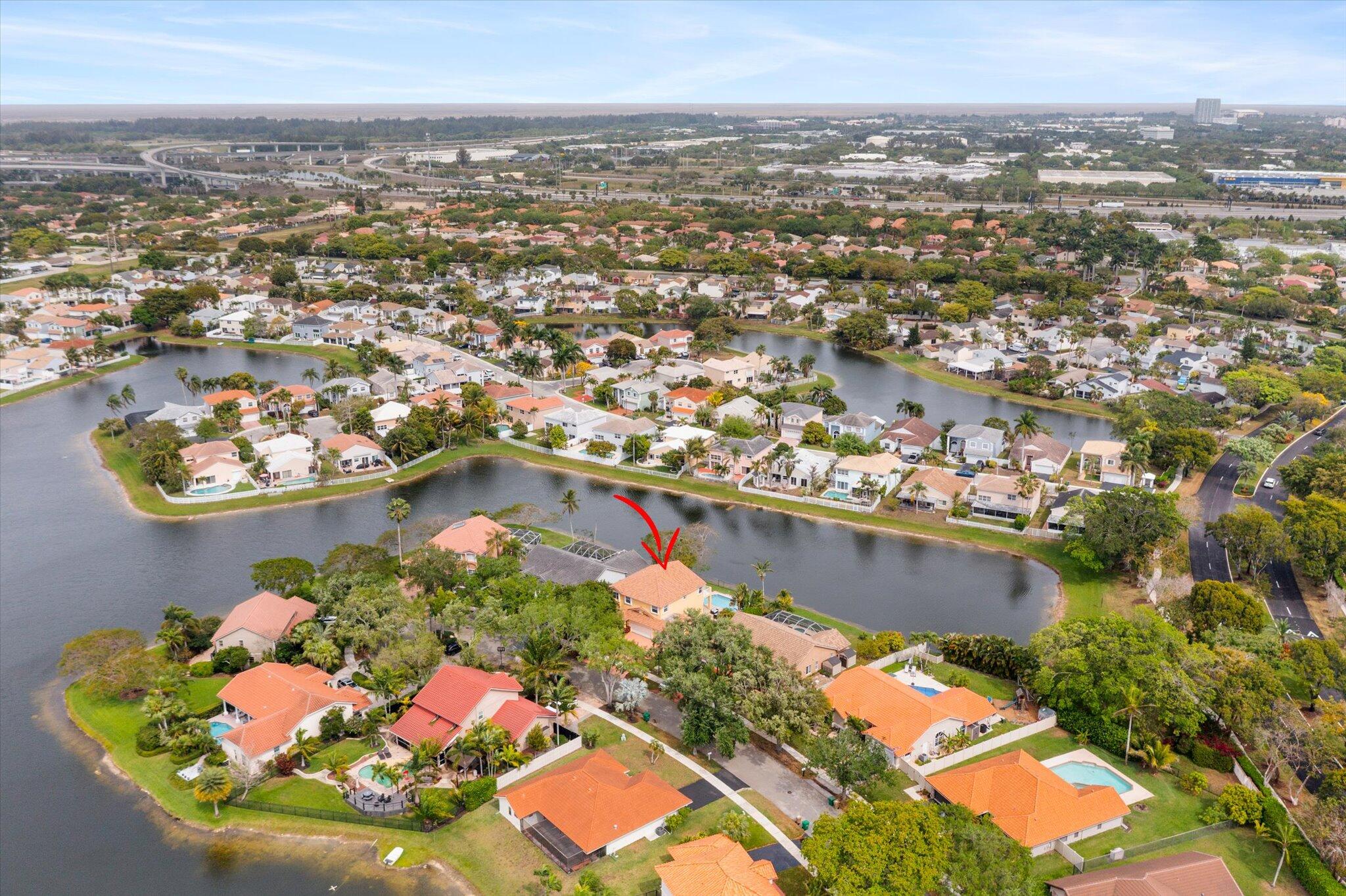 640 Culpepper Terrace Davie, FL 33325 - Photo 59 of 68 an aerial view of a house with a lake view