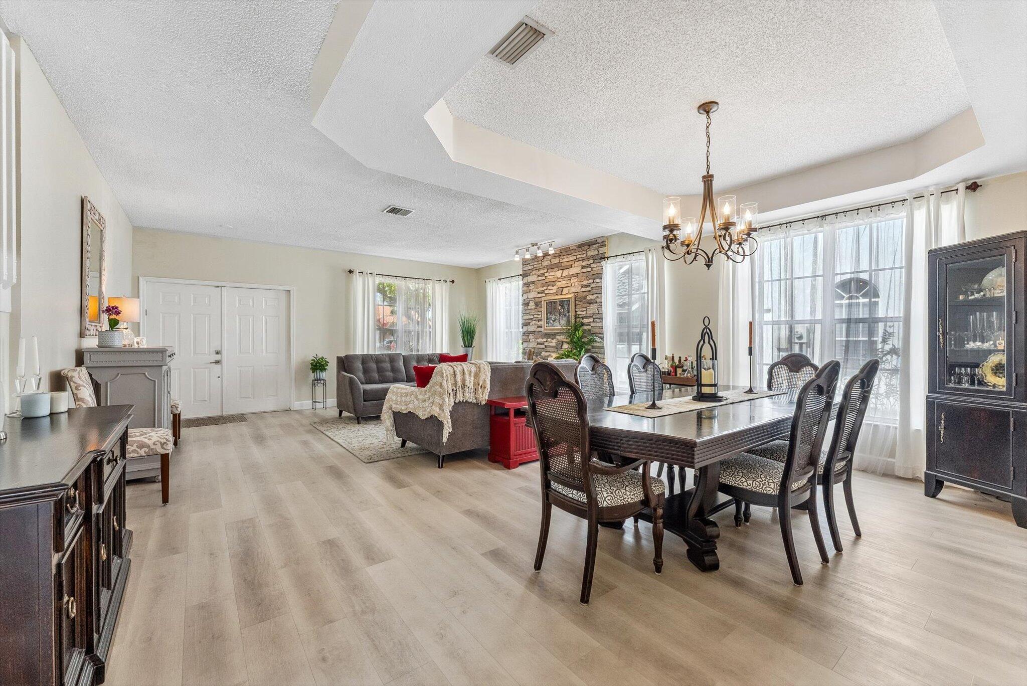 640 Culpepper Terrace Davie, FL 33325 - Photo 8 of 68 a view of a dining room with furniture window and wooden floor