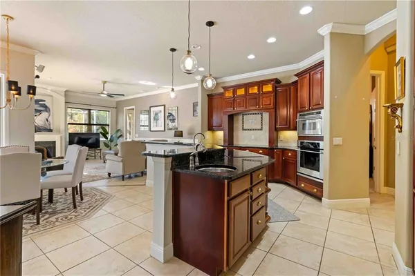 a kitchen with counter top space cabinets and stainless steel appliances