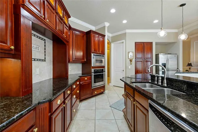 a dining room with furniture a chandelier and window