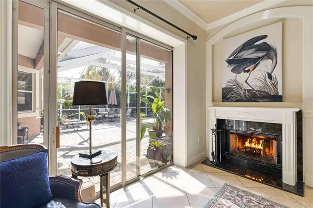 a spacious bedroom with a bed and a chandelier