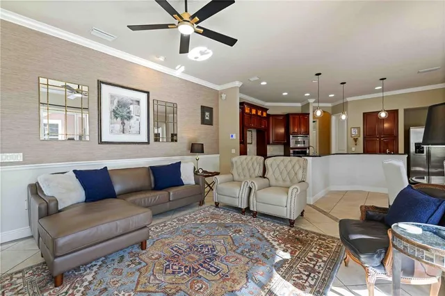 a bedroom with a bed a flat screen tv and a large window