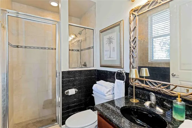 a bathroom with a shower and a window