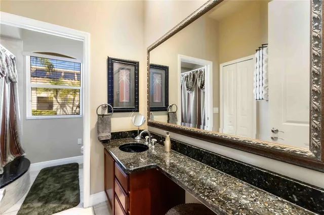 a bedroom with a bed and glass windows
