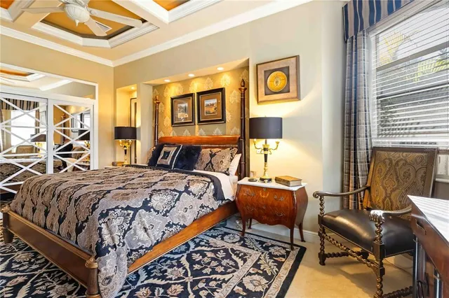 a living room with patio furniture and a potted plant