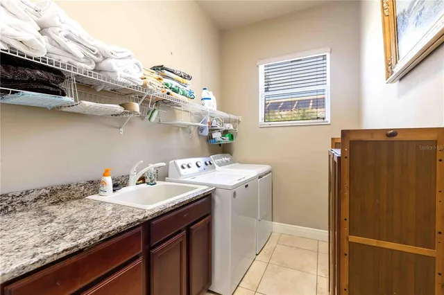 a view of a field with trees in the background