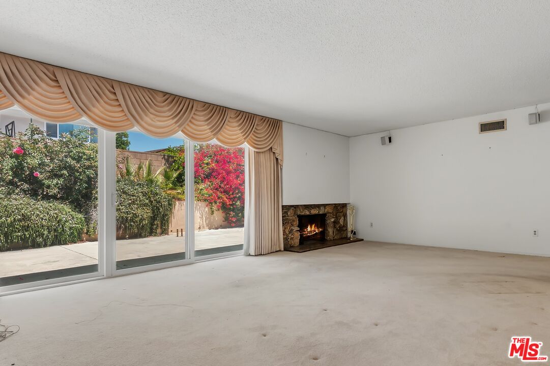 19131 Tulsa Street Porter Ranch, CA 91326 - Photo 9 of 43 a view of an empty room with a fireplace