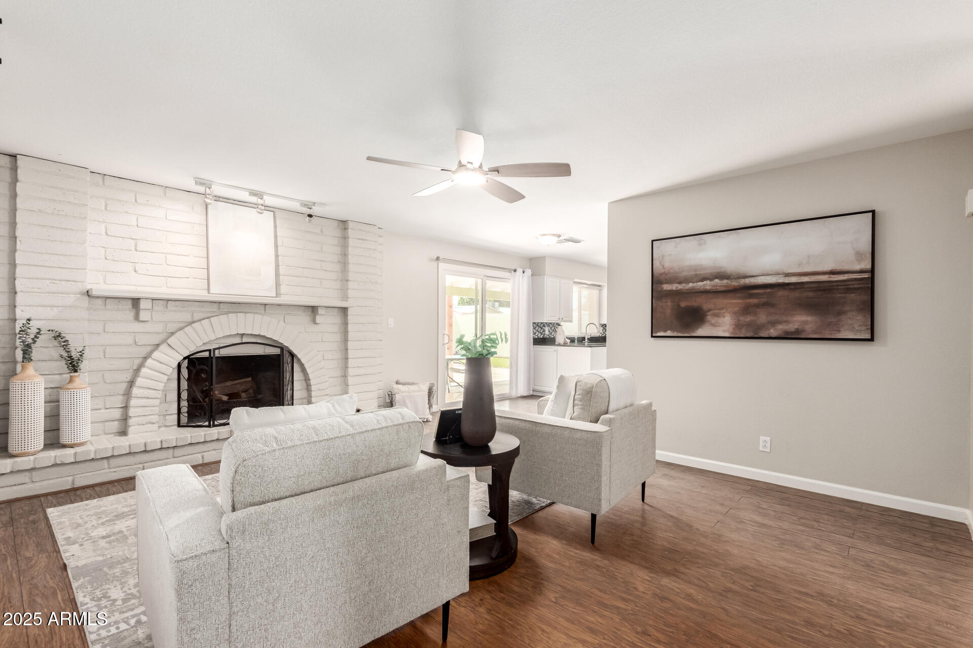 1237 East Gemini Drive Tempe, AZ 85283 - Photo 13 of 51 a living room with furniture and a fireplace