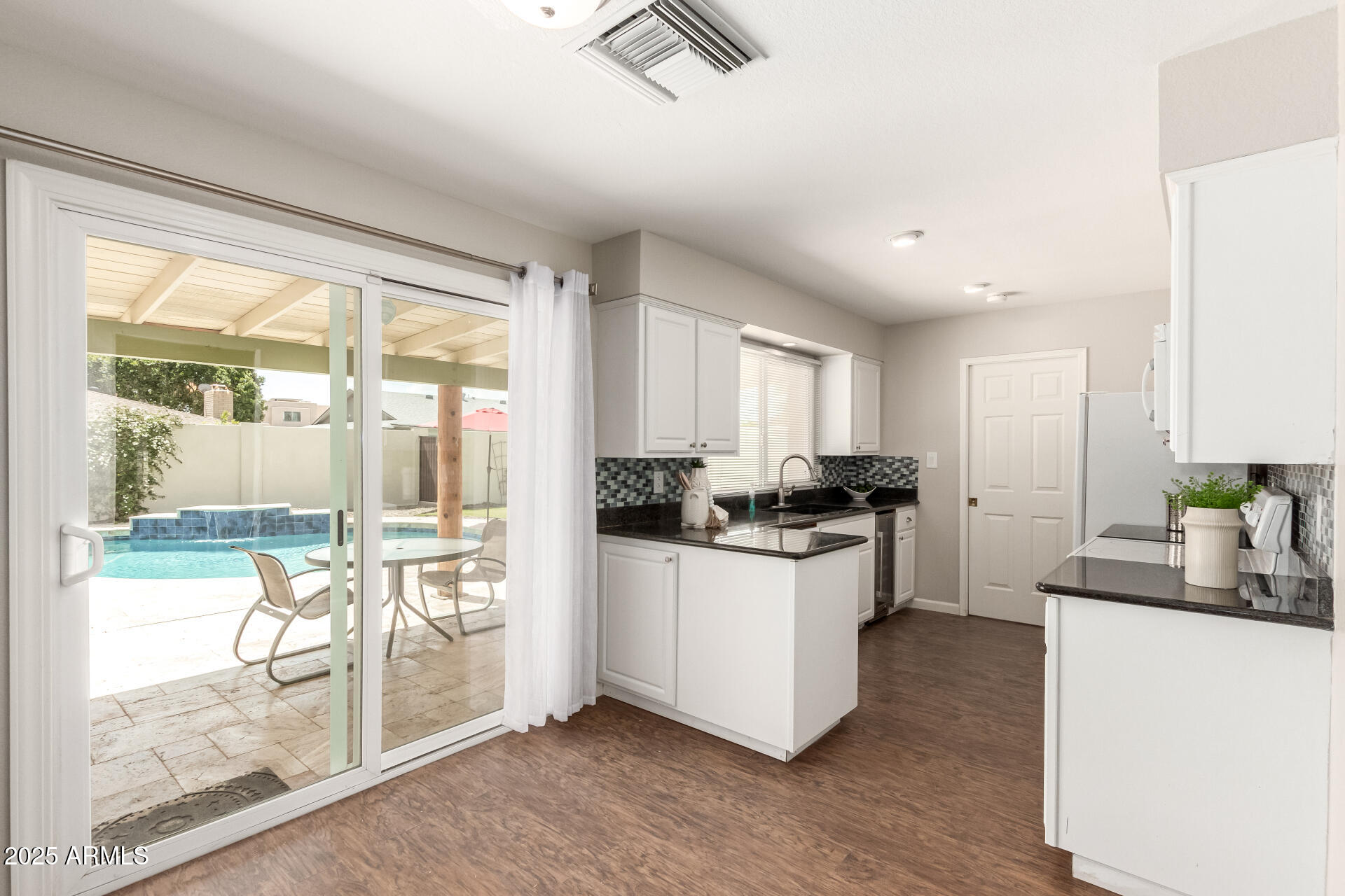 1237 East Gemini Drive Tempe, AZ 85283 - Photo 16 of 51 a kitchen with sink and refrigerator
