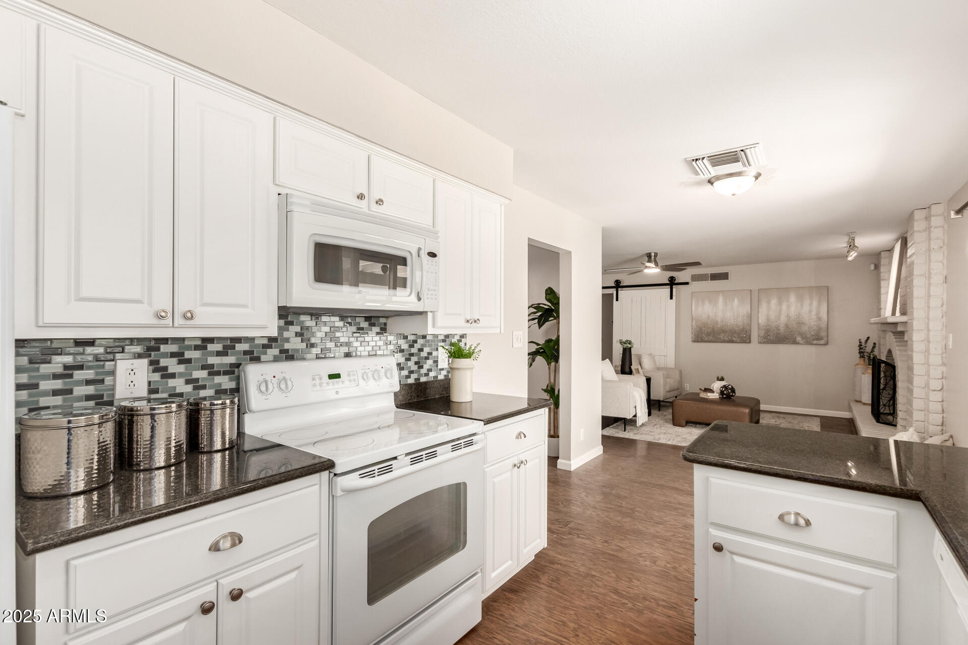 1237 East Gemini Drive Tempe, AZ 85283 - Photo 20 of 51 a kitchen with stainless steel appliances a stove a sink and a refrigerator