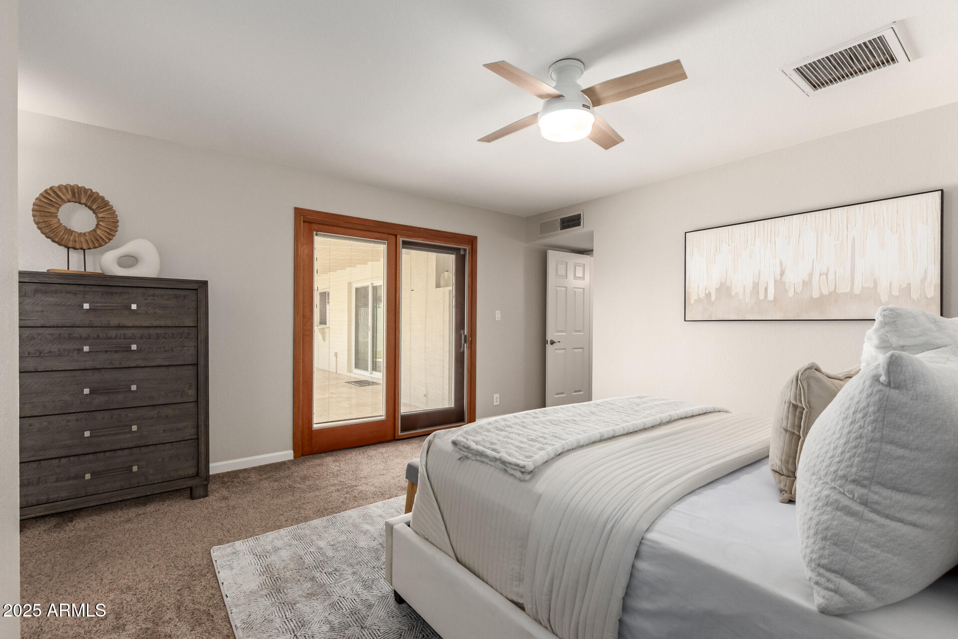 1237 East Gemini Drive Tempe, AZ 85283 - Photo 24 of 51 a bedroom with a bed and a chandelier