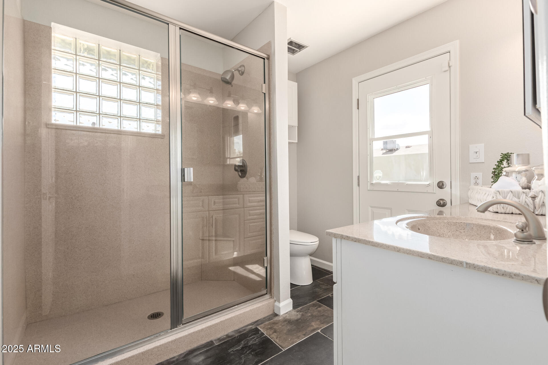 1237 East Gemini Drive Tempe, AZ 85283 - Photo 26 of 51 a bathroom with a shower sink and toilet
