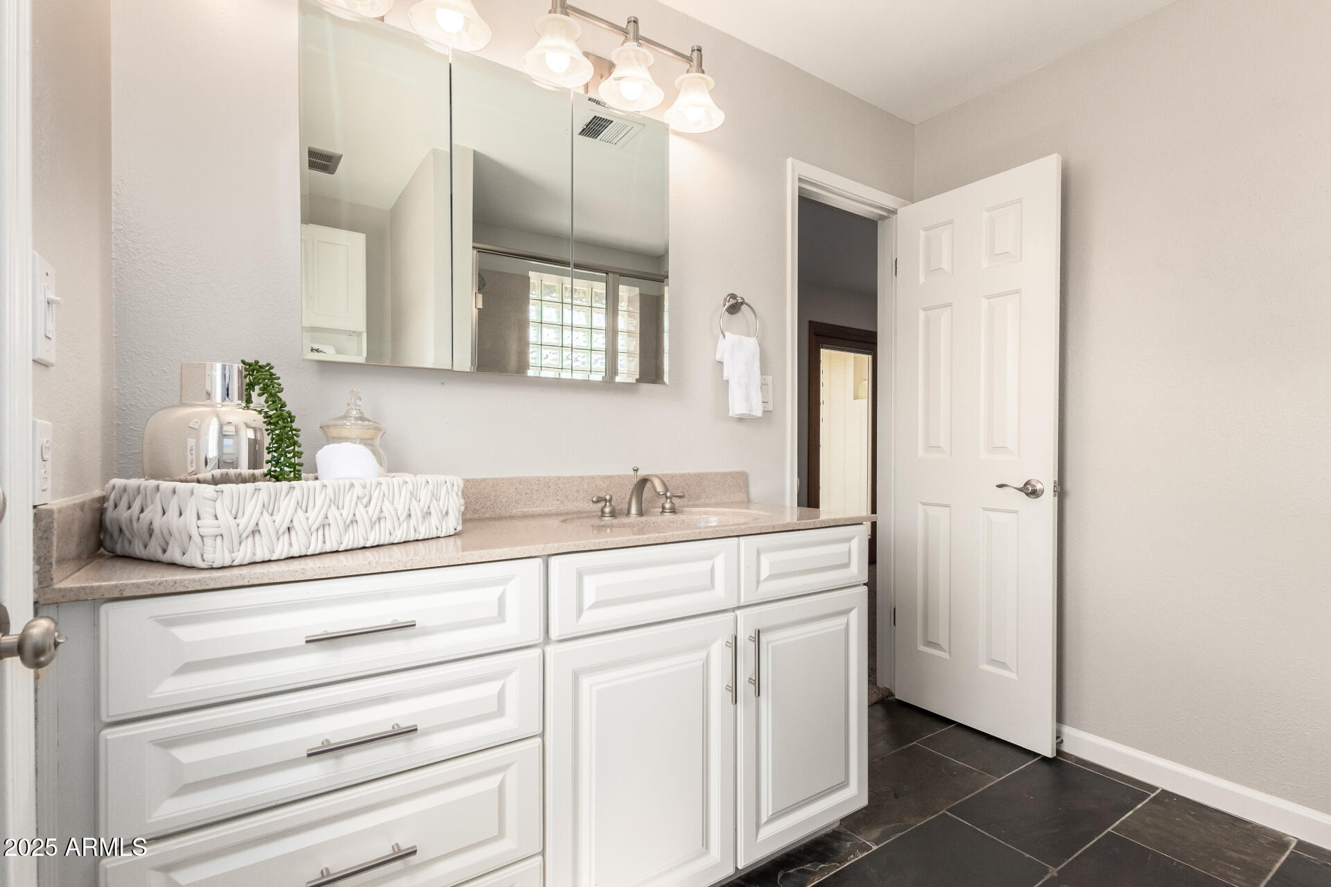 1237 East Gemini Drive Tempe, AZ 85283 - Photo 28 of 51 a bathroom with a granite countertop sink and a mirror