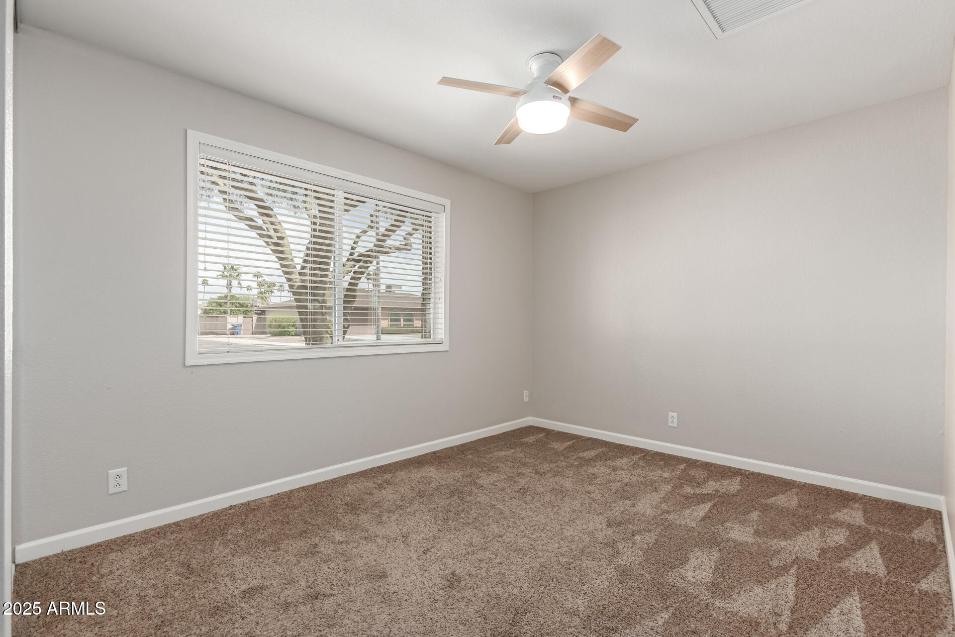 1237 East Gemini Drive Tempe, AZ 85283 - Photo 30 of 51 an empty room with a window