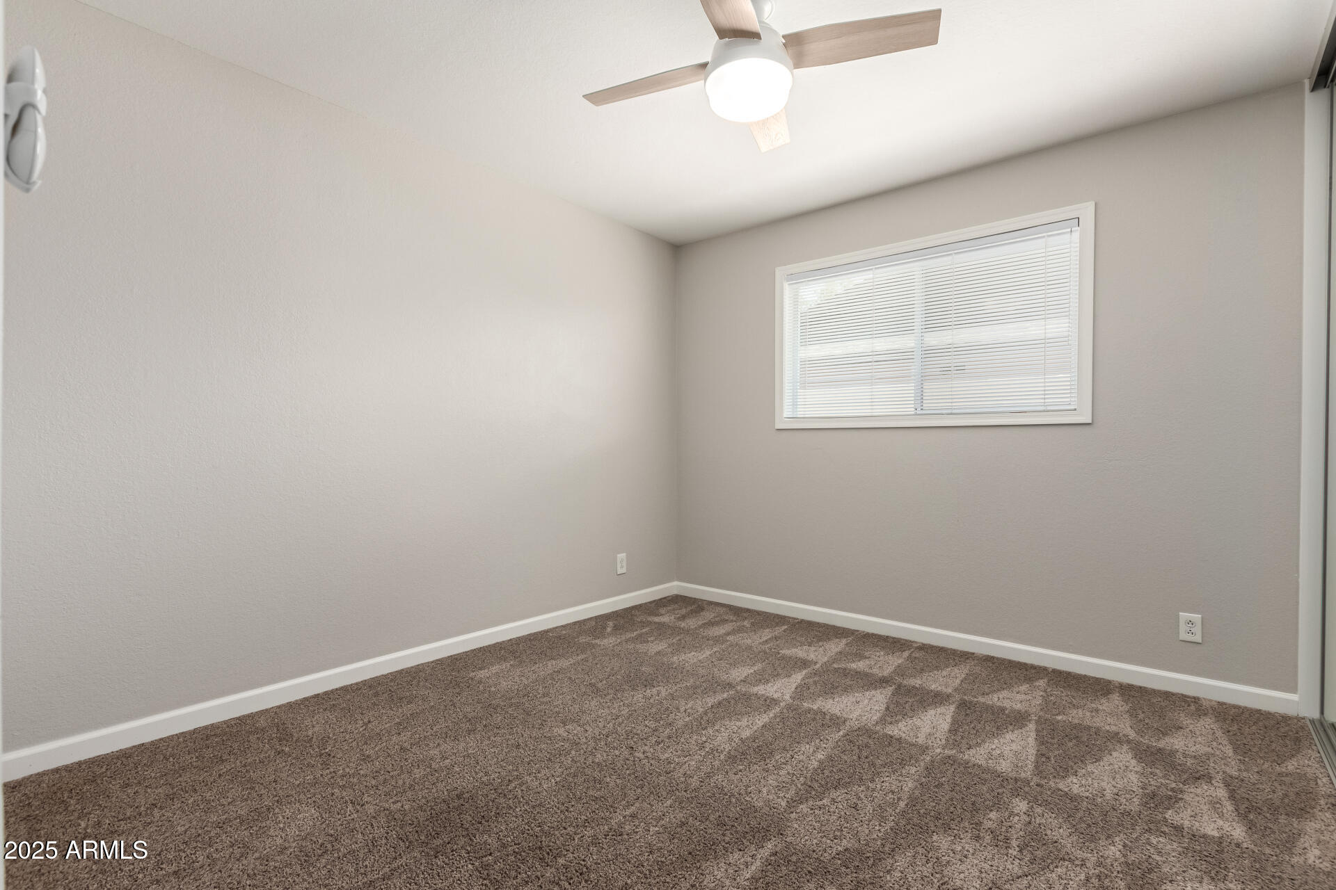 1237 East Gemini Drive Tempe, AZ 85283 - Photo 33 of 51 an empty room with a window